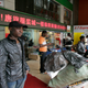 An African man stands near a shopping mall in the southern Chinese city of Guangzhou in Guangdong province March 27, 2009. In the past few years, tens of thousands of African and Arab traders have thronged to export hubs like Guangzhou and Yiwu to seek their fortunes, sourcing cheap China-made goods back home to massive markups in a growing, lucrative trade. Picture taken March 27, 2009. To match feature FRICTION-CHINA/AFRICANS REUTERS/James Pomfret (CHINA POLITICS BUSINESS) - RTR26Y9O